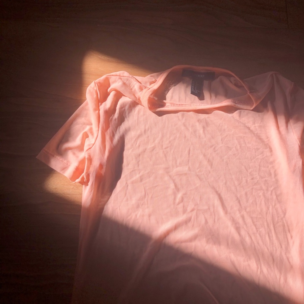 Light pink see-through body suit